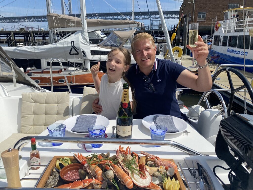 Robin and his daughter getting ready to tuck into the heaving seafood platter